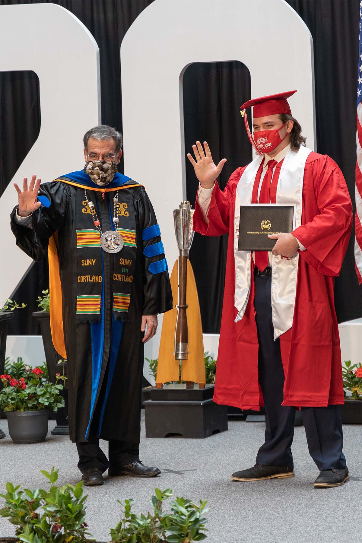 Undergraduate student at Commencement with President Bitterbaum